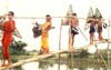 Child laborers crossing a bamboo bridge, click for larger image